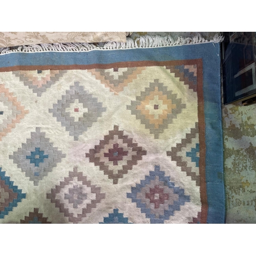 279 - Two wool rugs, soft pastel tones, approx 290cm x 238cm and 194cm x 124cm (2)