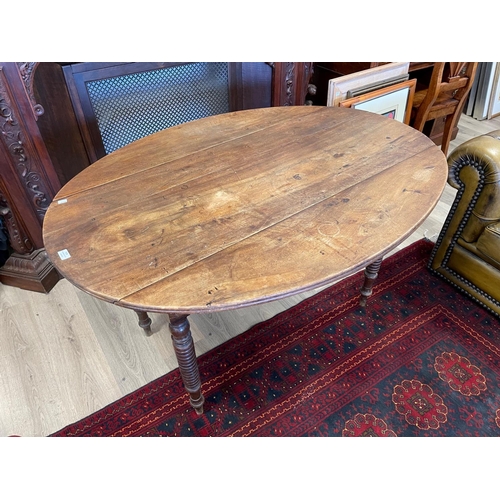 1216 - Rustic Antique Walnut drop side table standing on multi ring turned legs, approx 132 cm long x 101 c... 