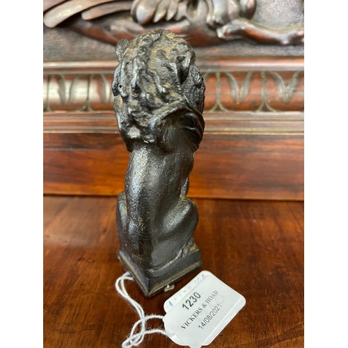 1230 - Antique cast iron figure of a seated lion, indistinct signature to base, approx 12cm H