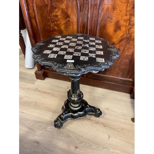 1236 - Antique mid Victorian paper Mache games table, with snap top inlaid with mother of pearl, and painte... 