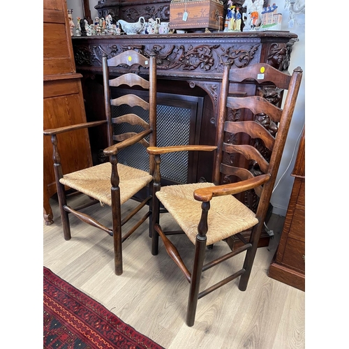 1248 - Pair of matched antique late Early 19th century English ladder back rush seated arm chairs in beech ... 