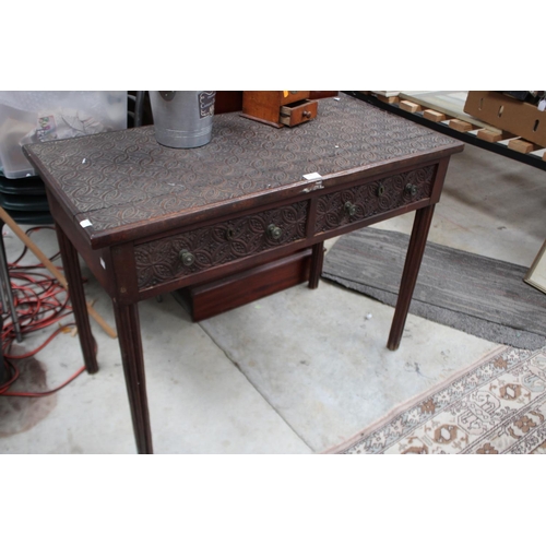 483 - Antique Indian carved hardwood  two drawer desk or side table, circular fluted legs, approx 75cm h x... 