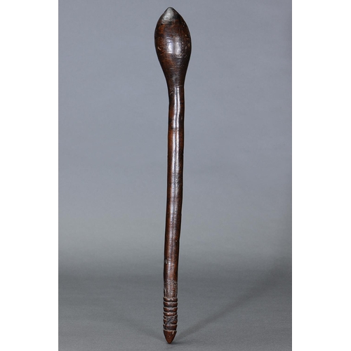 1015 - EARLY BULBOUS CLUB, VICTORIA, Carved and engraved hardwood (no custom stand) The curving shaft of ci... 