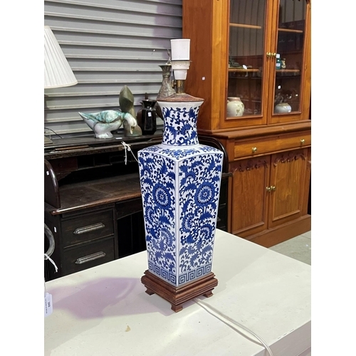 268 - Pair of Chinese blue and white square tapering lamps, wooden bases, approx 52cm including fittings  ... 