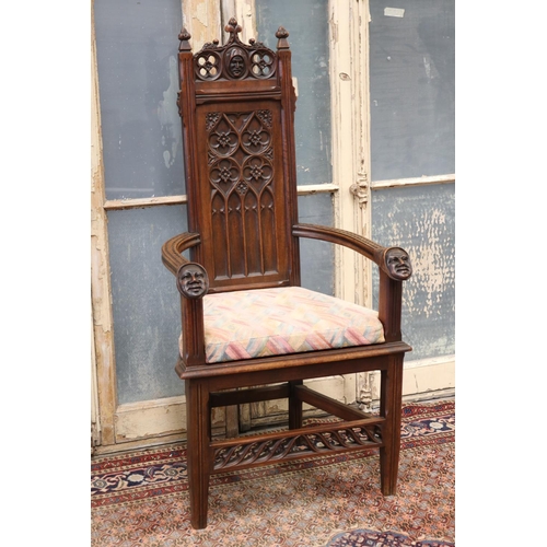 119 - Antique French Gothic style armchair, carved heads to arms, shaped cushion, approx 128cm H x 63cm W ... 