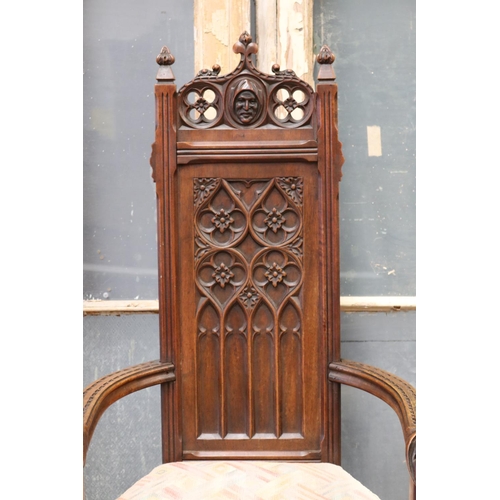 119 - Antique French Gothic style armchair, carved heads to arms, shaped cushion, approx 128cm H x 63cm W ... 