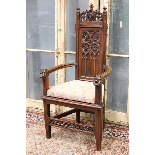 119 - Antique French Gothic style armchair, carved heads to arms, shaped cushion, approx 128cm H x 63cm W ... 