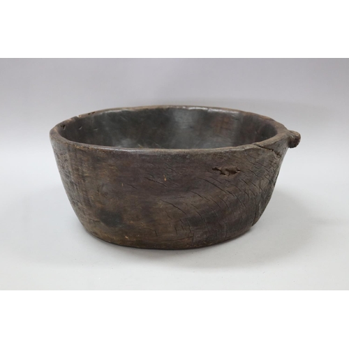 129 - Old rustic carved wood bowl, with carved loop for hanging, approx 13cm H x 33cm dia