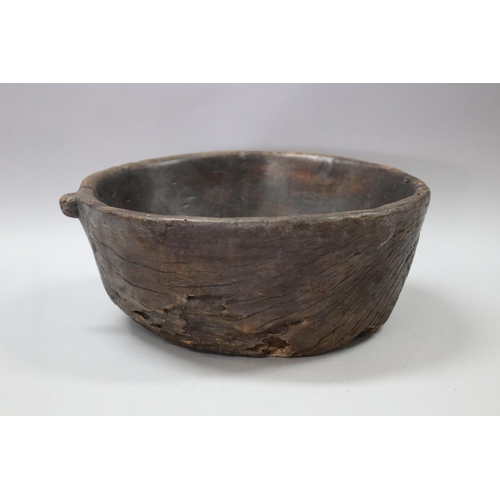 129 - Old rustic carved wood bowl, with carved loop for hanging, approx 13cm H x 33cm dia