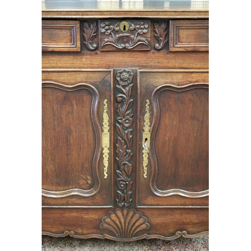 13 - Antique French Louis XV style buffet, two doors below three drawers, carved floral motif in relief w... 