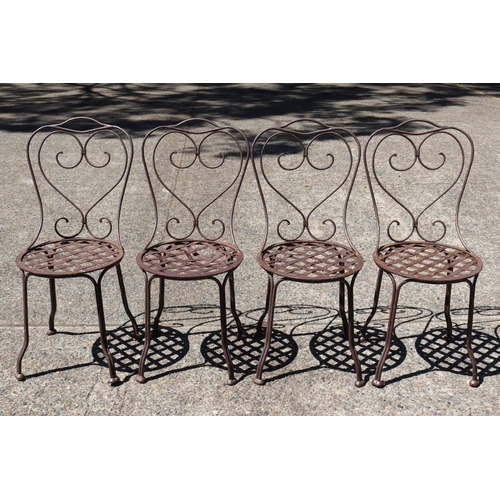 130 - Set of four French wrought iron garden chairs, heart backs & lattice seats (4)