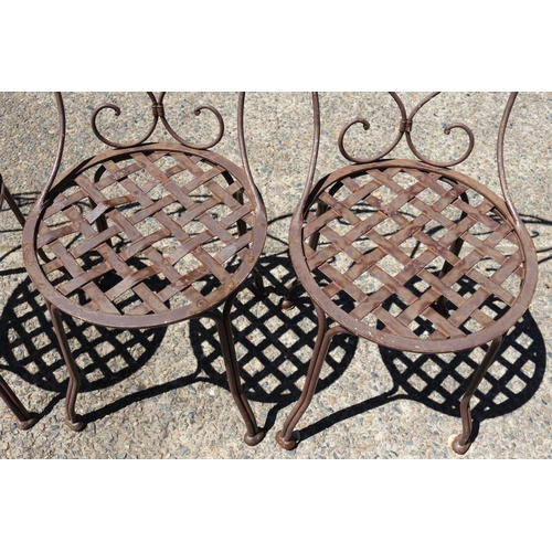 130 - Set of four French wrought iron garden chairs, heart backs & lattice seats (4)