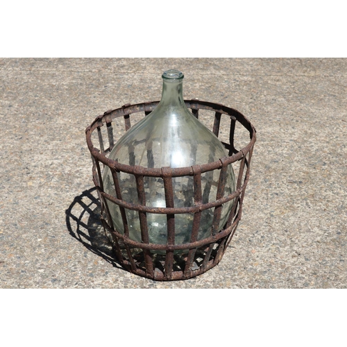 138 - Old French glass wine makers bottle in metal wire basket, total approx 57cm H