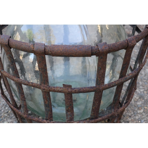 138 - Old French glass wine makers bottle in metal wire basket, total approx 57cm H