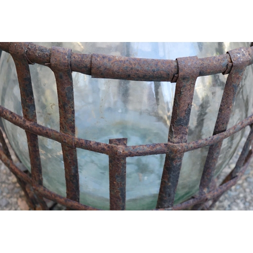 138 - Old French glass wine makers bottle in metal wire basket, total approx 57cm H