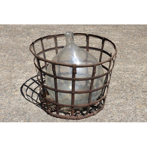 139 - Old French glass wine makers bottle in metal wire basket, total approx 63cm H