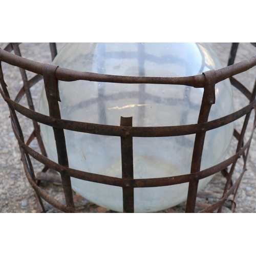 139 - Old French glass wine makers bottle in metal wire basket, total approx 63cm H