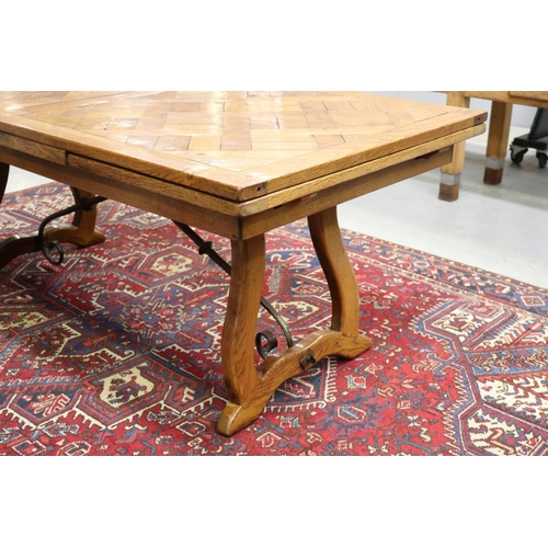 158 - French 18th century style Spanish oak parquetry top dining table, with hand forged wrought iron stre... 