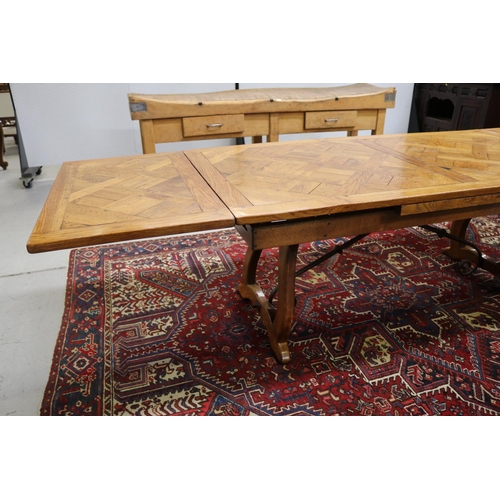 158 - French 18th century style Spanish oak parquetry top dining table, with hand forged wrought iron stre... 