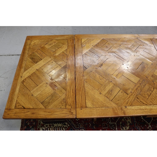 158 - French 18th century style Spanish oak parquetry top dining table, with hand forged wrought iron stre... 