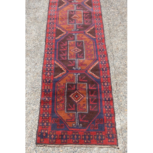 202 - Persian Baluchi carpet, approx 245cm x 69cm