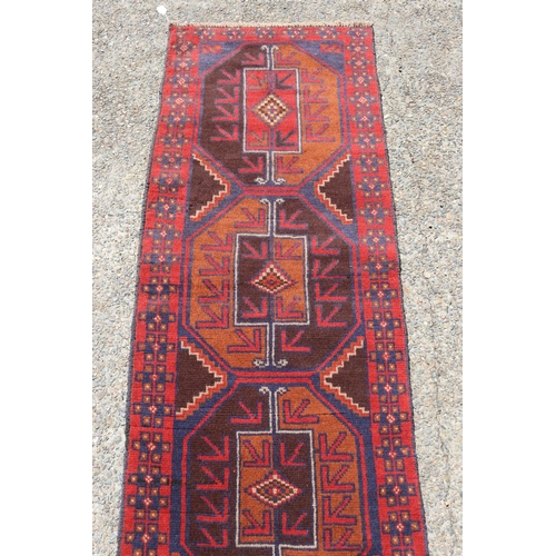 202 - Persian Baluchi carpet, approx 245cm x 69cm