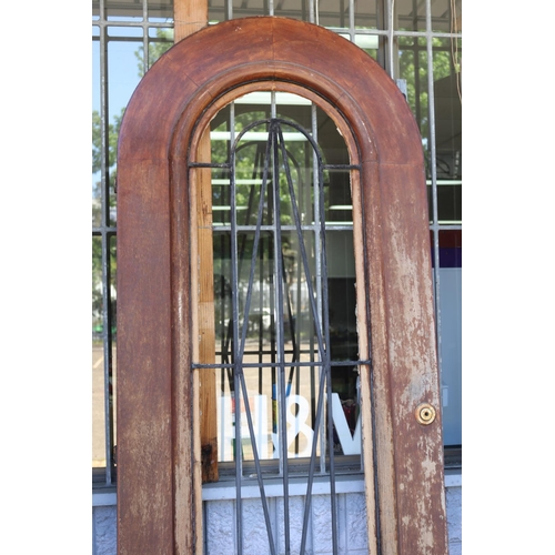 216 - French Art Deco arched top entrance door, wrought iron panel, letter box slot, approx 222cm H x 85cm... 