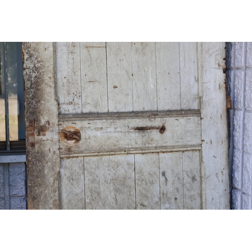 217 - Antique French prison door, in original rustic condition, chicken wire hole, archer top, approx 220c... 