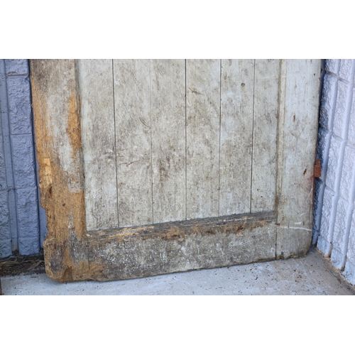 217 - Antique French prison door, in original rustic condition, chicken wire hole, archer top, approx 220c... 