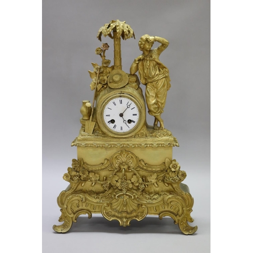 54 - Fine antique 19th century French gilt bronze figural mantle clock, young gent leaning against palm t... 