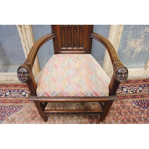 119 - Antique French Gothic style armchair, carved heads to arms, shaped cushion, approx 128cm H x 63cm W ... 