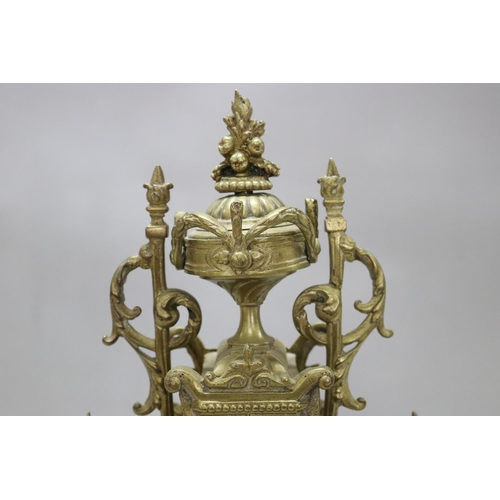 124 - Vintage French Renaissance revival brass cased mantle clock, decorated with swags, trophy & Griffin ... 