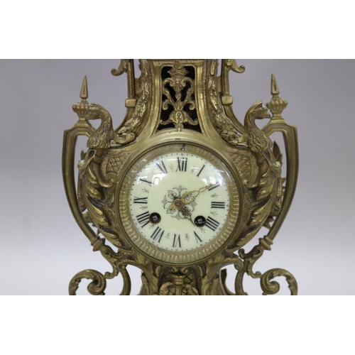 124 - Vintage French Renaissance revival brass cased mantle clock, decorated with swags, trophy & Griffin ... 