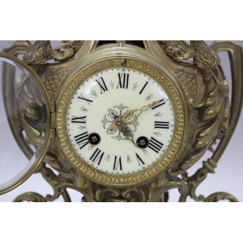 124 - Vintage French Renaissance revival brass cased mantle clock, decorated with swags, trophy & Griffin ... 