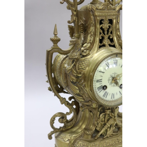 124 - Vintage French Renaissance revival brass cased mantle clock, decorated with swags, trophy & Griffin ... 