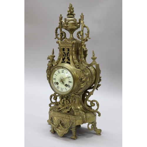 124 - Vintage French Renaissance revival brass cased mantle clock, decorated with swags, trophy & Griffin ... 