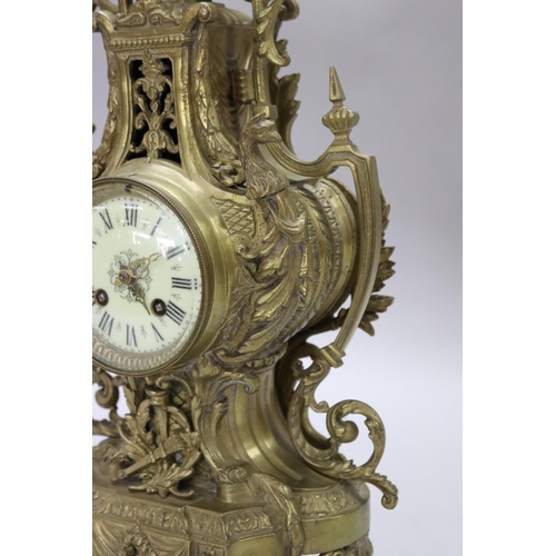 124 - Vintage French Renaissance revival brass cased mantle clock, decorated with swags, trophy & Griffin ... 