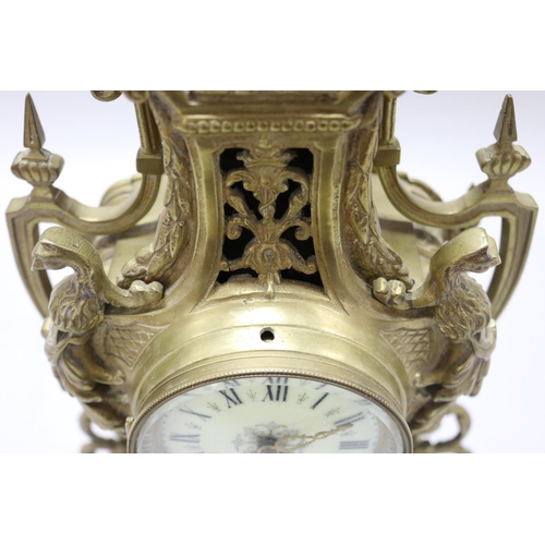 124 - Vintage French Renaissance revival brass cased mantle clock, decorated with swags, trophy & Griffin ... 