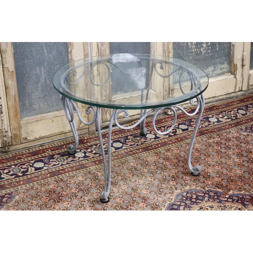 125 - La Forge glass top wrought iron coffee table, approx 41cm H x 65cm dia