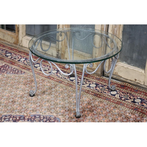 125 - La Forge glass top wrought iron coffee table, approx 41cm H x 65cm dia