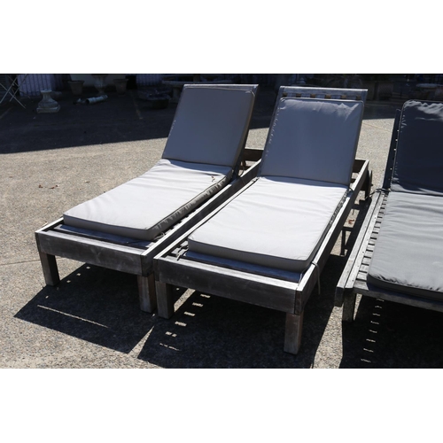 128 - Two matched pairs of wooden outdoor sun lounges with cushions, approx 34cm H x 227cm L (including wh... 