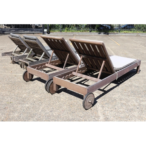 128 - Two matched pairs of wooden outdoor sun lounges with cushions, approx 34cm H x 227cm L (including wh... 