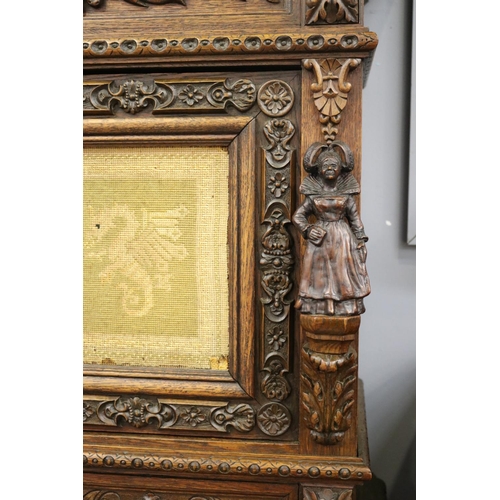 114 - Antique French Renaissance revival buffet a deux corps, needlework panels of mythical beasts, heavil... 