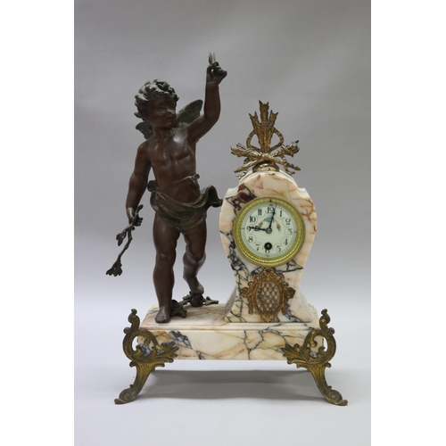 183 - Antique French figural spelter & marble mantle clock, mounted with a putto figure, holding butterfly... 