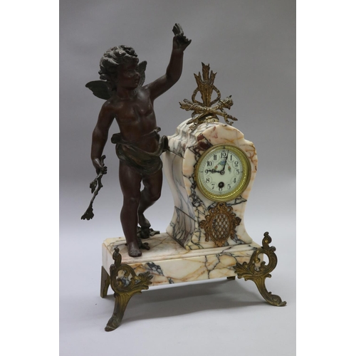 183 - Antique French figural spelter & marble mantle clock, mounted with a putto figure, holding butterfly... 