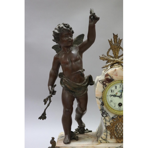 183 - Antique French figural spelter & marble mantle clock, mounted with a putto figure, holding butterfly... 