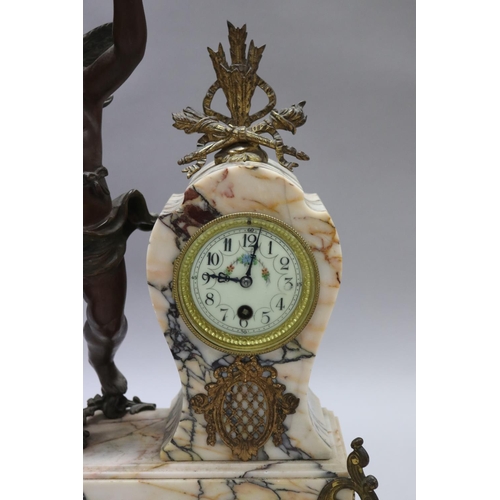 183 - Antique French figural spelter & marble mantle clock, mounted with a putto figure, holding butterfly... 