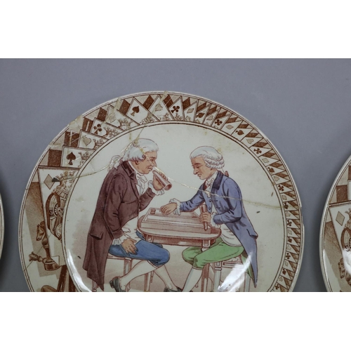 46 - Set of twelve antique French Sarreguemines porcelain plates, showing different scenes of gaming, mar... 