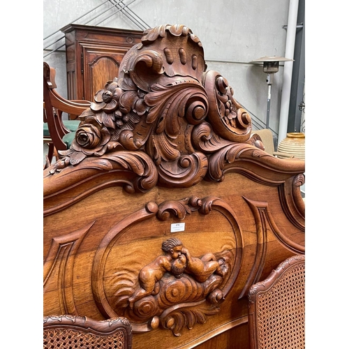 1119 - Antique French carved walnut Louis XV style bed, approx 165cm H x 213cm L x 148cm W