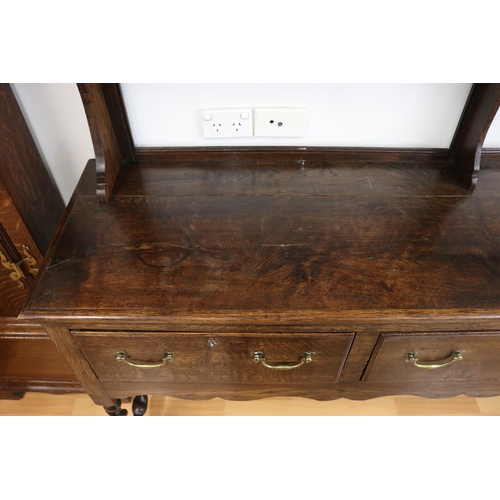 1005 - Antique English 17th century style oak dresser with open plate rack over three drawers on barley twi... 